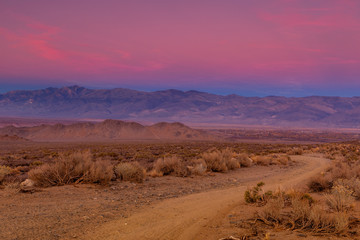 Fototapeta na wymiar Gravel road at sunset in California's Sierra Nevada area