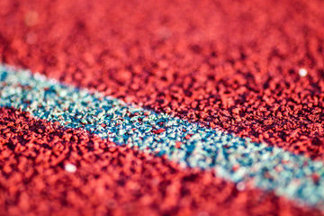 Red running sport track background and texture. Sport running track concept.