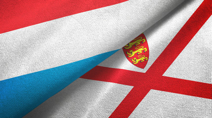 Luxembourg and Jersey two flags textile cloth, fabric texture