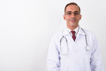 Fototapeta premium Portrait of mature handsome Persian man doctor