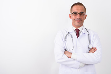 Portrait of mature handsome Persian man doctor