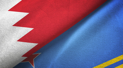 Fototapeta na wymiar Bahrain and Aruba two flags textile cloth, fabric texture