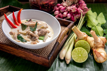 Chicken Coconut Soup (Tom Kha Gai),Coconut milk soup with chicken and Thai ingredients on the table, top view, Thai food that is popular in Thailand.