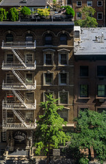 Aerial view of fire escape ladders and balconies in a residential building in Midtown Manhattan, New York, USA