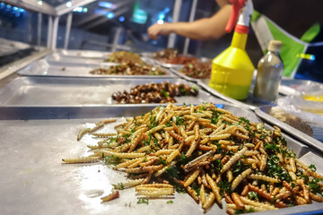 fried bamboo caterpillar at night market street