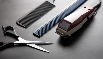 Hair cutting tools on a black background