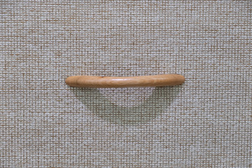 The surface pattern of the box is made of fabric. With a handle made of wood