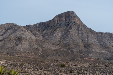Low angle landscape of grey and black stone hillside at Red Rock Canyon Conservation Area in Las Vegas, Nevada