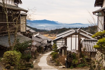 石畳の坂道から見下ろす古い町並みの風景／Magome-juku is an old town in Gifu Prefecture, Japan.