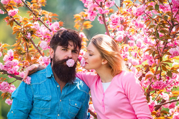 Romantic couple in love feeling happiness. Gappy couple in love outdoors. Happy couple smiling in a spring park on a sunny day. Happy easter.