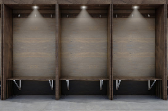 Empty wooden cubicles with a bench and hangers in a sports locker change room - 3D render