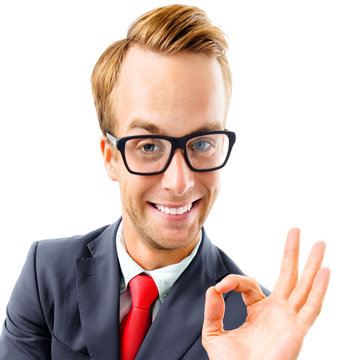 OK! Funny happy excited businessman in glasses showing ok gesture or zero, confident suit and red tie, isolated over white background. Business concept square composition picture.