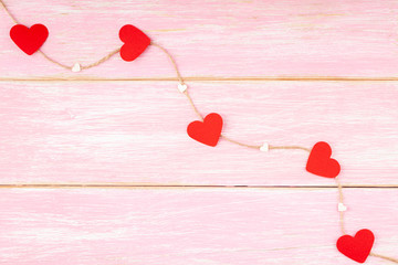Jute Rope with Red Glitter Hearts and Confetti Small Hearts on Pink Wooden Background. Love,...