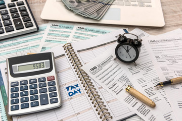 US 1040 Tax form with notepad, calculator  and pen. Tax concept