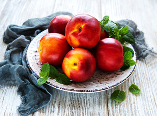 Plate with fresh nectarines