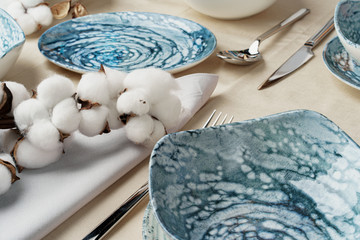 Fototapeta na wymiar Beautiful table setting decorated with cotton buds