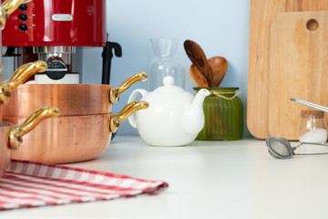 Kitchen utensils on a modern home kitchen table top