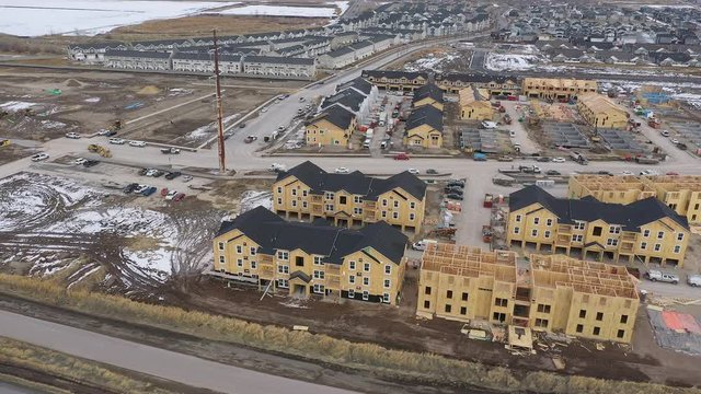 Construction of new housing development taking over empty land which was once fields with wildlife.