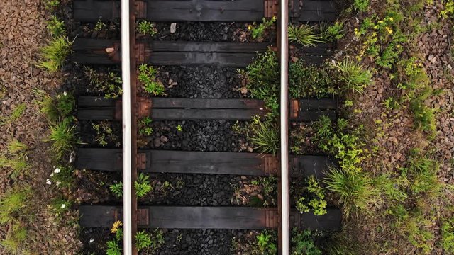 Railroad track close up. Train railway tracks in summer. View from above.
