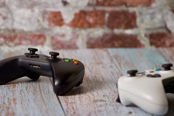 Black and white gamepad on table for two players © Magic_B