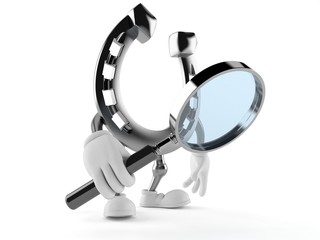 Horseshoe character looking through magnifying glass