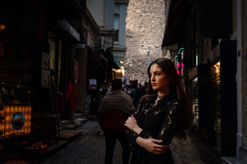 Portrait of beautiful woman with view of Galata tower in Istanbul, Turkey