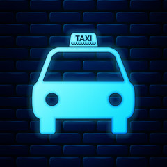 Glowing neon Taxi car icon isolated on brick wall background. Vector Illustration