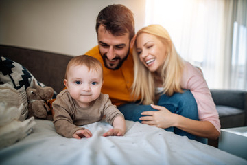 Parents changes diapers to their little baby