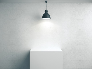 Blank concrete wall, podium and lamp.