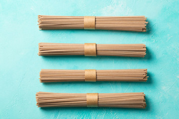 Noodles soba on blue background. Traditional asian food. Top view.