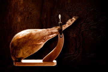 Whole Spanish ham leg extra quality on wooden background