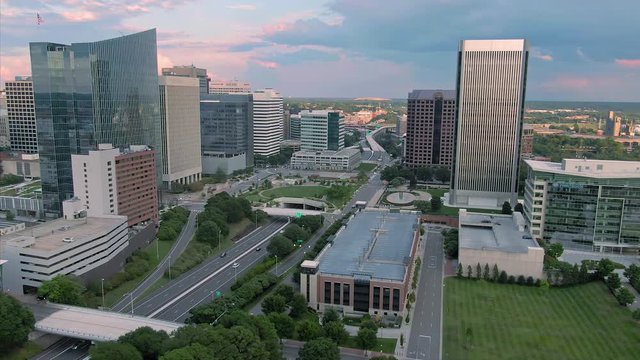 Aerial: Richmond city skyline and traffic at sunset, Virginia, USA. 