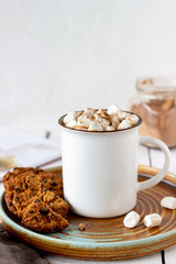 Hot chocolate with marshmallows in a white mug on a white background. Recipes.