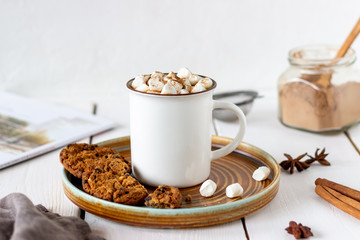 Hot chocolate with marshmallows in a white mug on a white background. Recipes.
