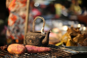 An old traditional kettle on the grill