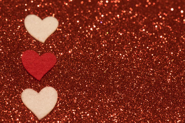 Hearts over red abstract background with bokeh defocused lights