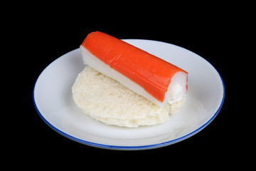 Soft cheese crab stick surimi  and white round wheat bread as a sandwich isolated black
