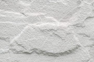 Patterned white sandstone texture abstract background.
