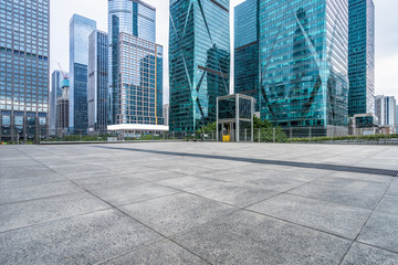 Fototapeta na wymiar empty pavement and modern buildings in city.