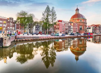 Deurstickers Amsterdam Canal houses at sunset reflections, Netherlands © TTstudio