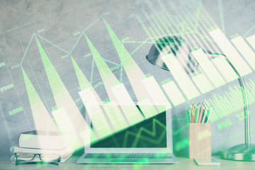 Multi exposure of graph and financial info and work space with computer background. Concept of international online trading.