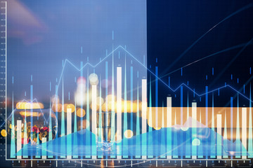 Financial graph colorful drawing and table with computer on background. Multi exposure. Concept of international markets.