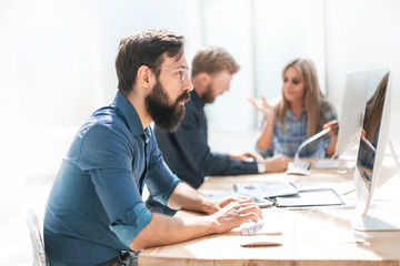 attentive business man working on a computer in the office