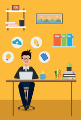 Designer working on laptop at workplace office