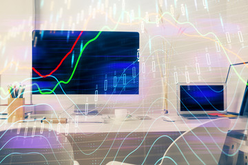 Forex market chart hologram and personal computer background. Double exposure. Concept of investment.