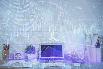Forex market graph hologram and personal computer on background. Double exposure. Concept of investment.
