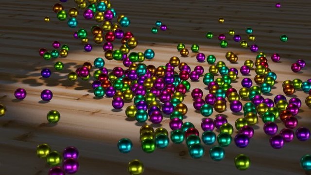colorful marbles falling onto a wooden ground, relaxing movement of metallic spheres, 4k 