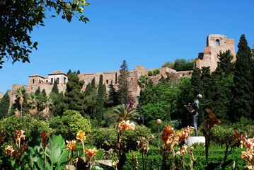 View of the castle seen from the Pedro Luis Alonso gardens, Malaga, Spain.