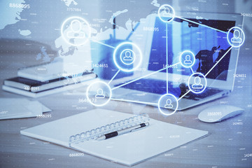 Computer on desktop with social network theme icon. Multi exposure. Concept of international connections.