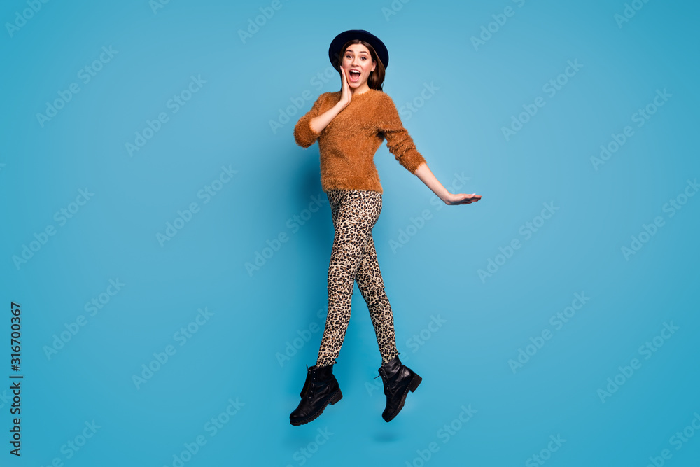 Sticker Full length photo of cheerful astonished girl jump look incredible bargains discount scream wow omg impressed jump wear stylish autumn spring style outfit isolated over blue color background